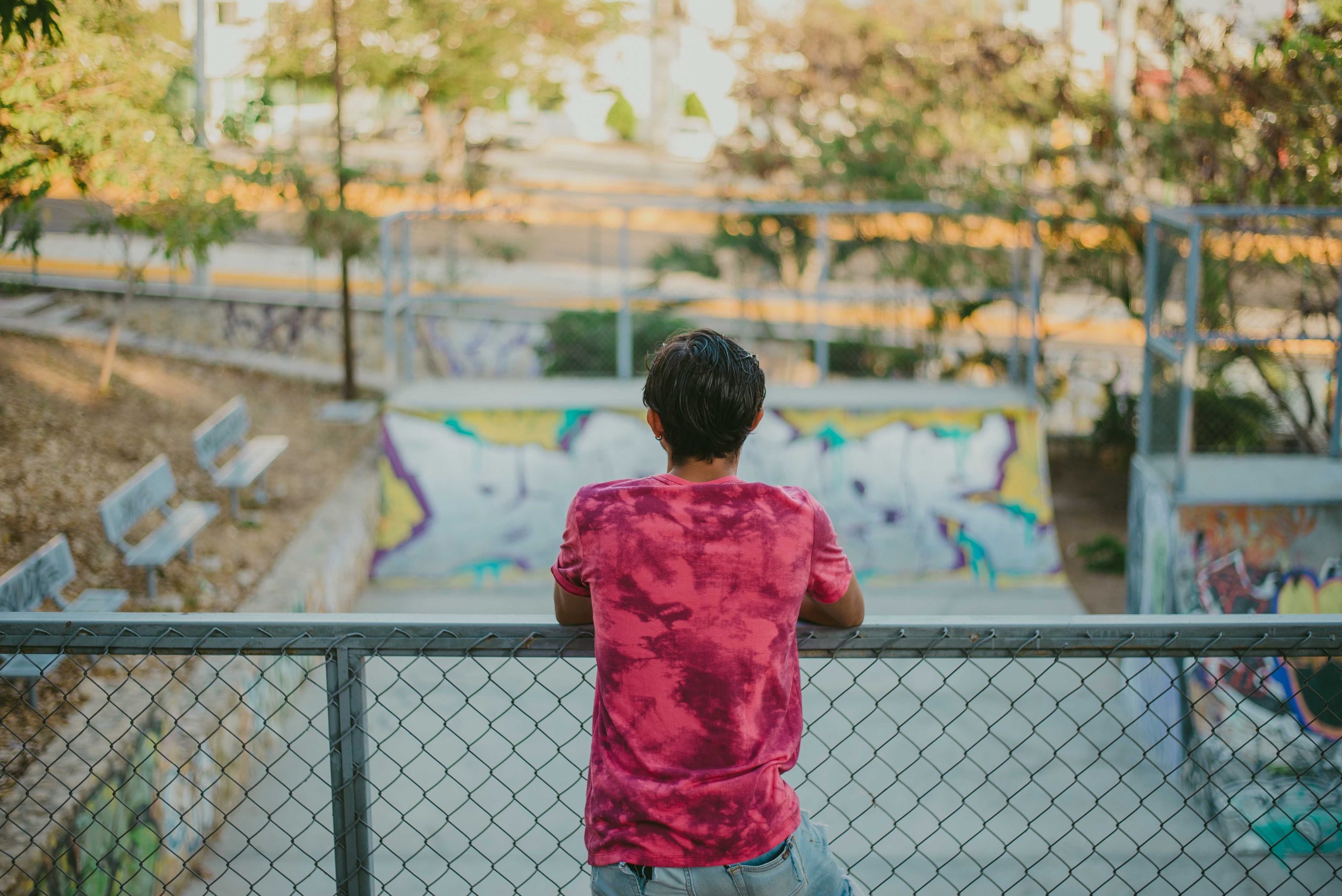 A young person looking out over a city